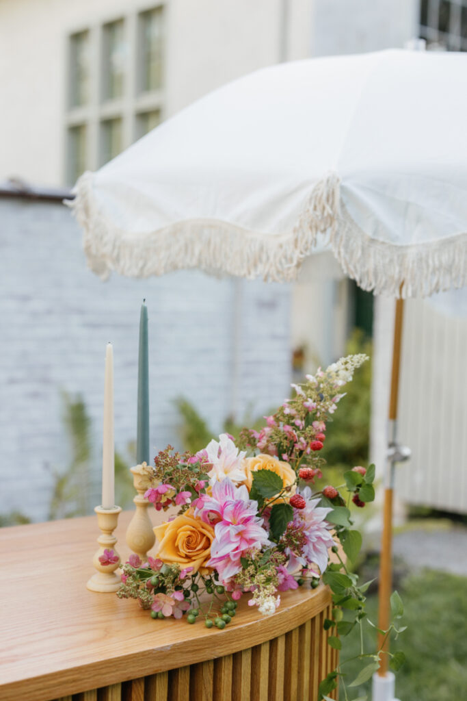 Bold autumn floral arrangement for wedding bar. 