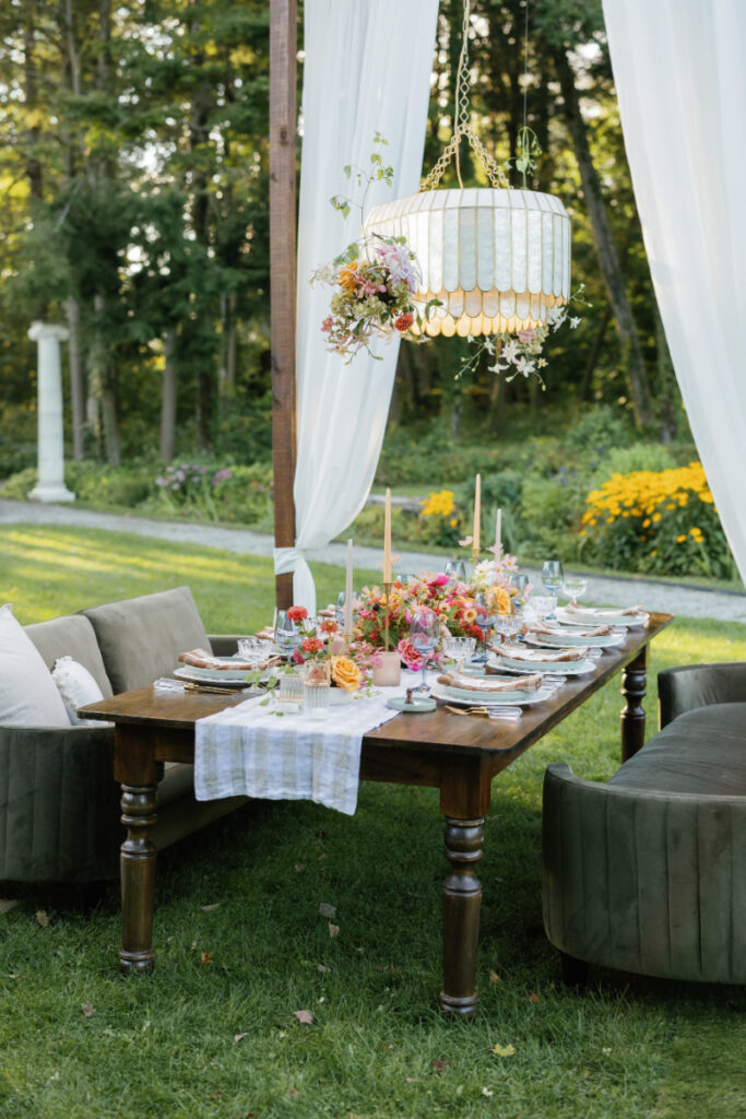 New England wedding table setting with locally-sourced, bold autumn flowers. 