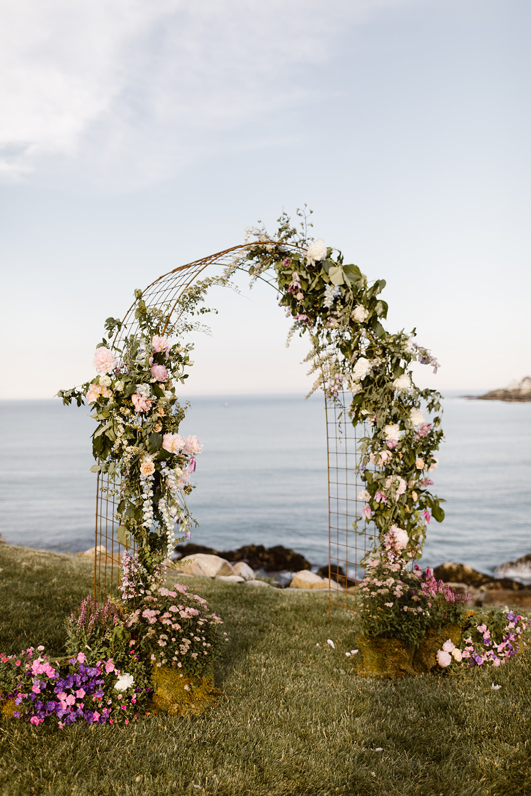 Wire arch decorated with luxury florals by a New England florist.