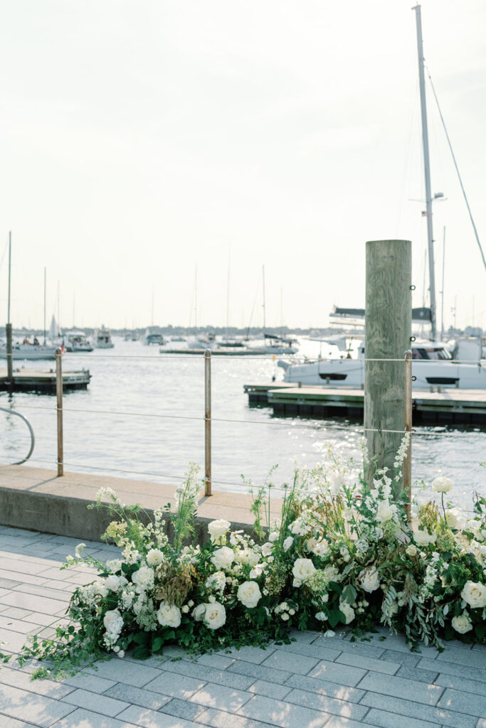 Lovely flower arrangement with a view of the harbor in the background