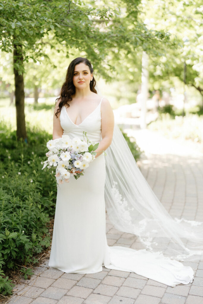 Bride with her bouquet in the garden