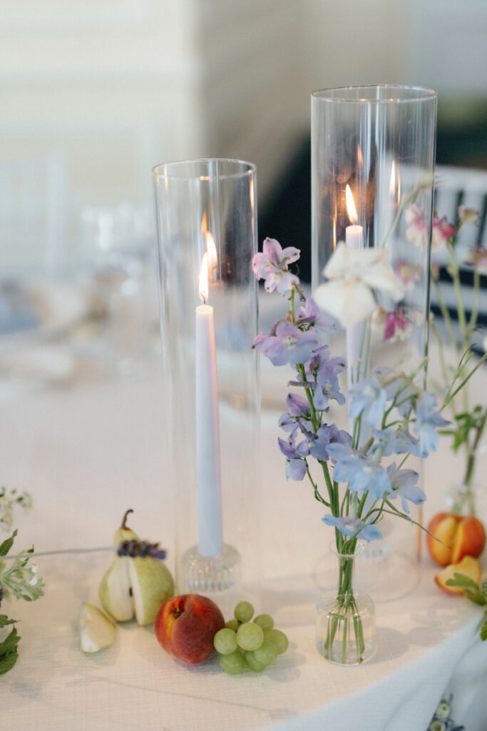 elegant candles with seasonal fruit like grapes, pears and peaches 