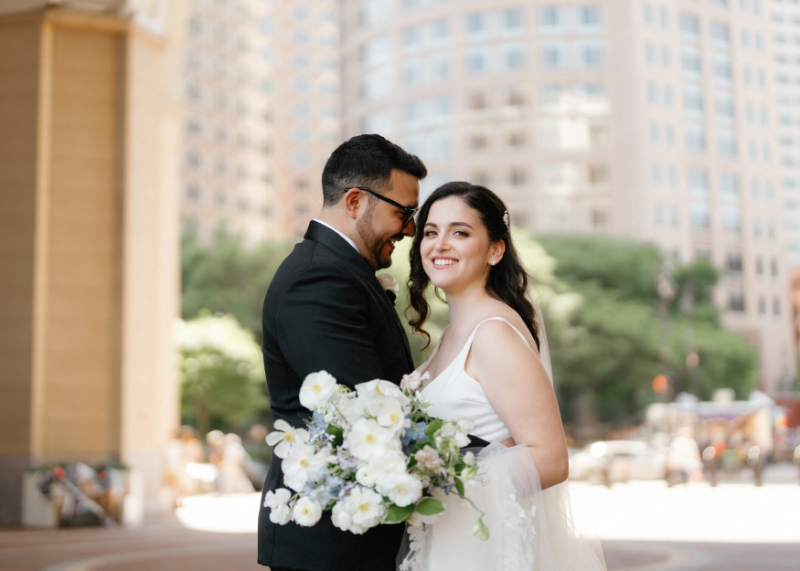 Groom whispering sweet things to his bride on their wedding day 