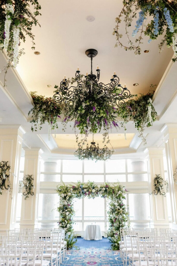 floral chandelier design for a wedding above a ceremony space