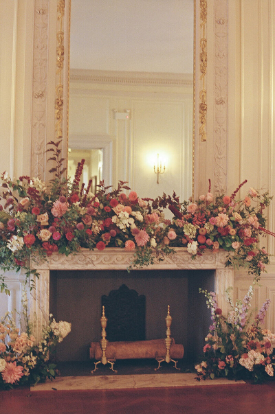 glen manor house fireplace mantel decorated with luxury florals